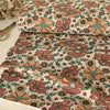 Baumwolljersey Vintage Blumen Rost-Beige