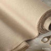 detailfoto-von-dekostoff-meterware-rolle-in-natur-beige-mit-eingewebtem-goldfaden