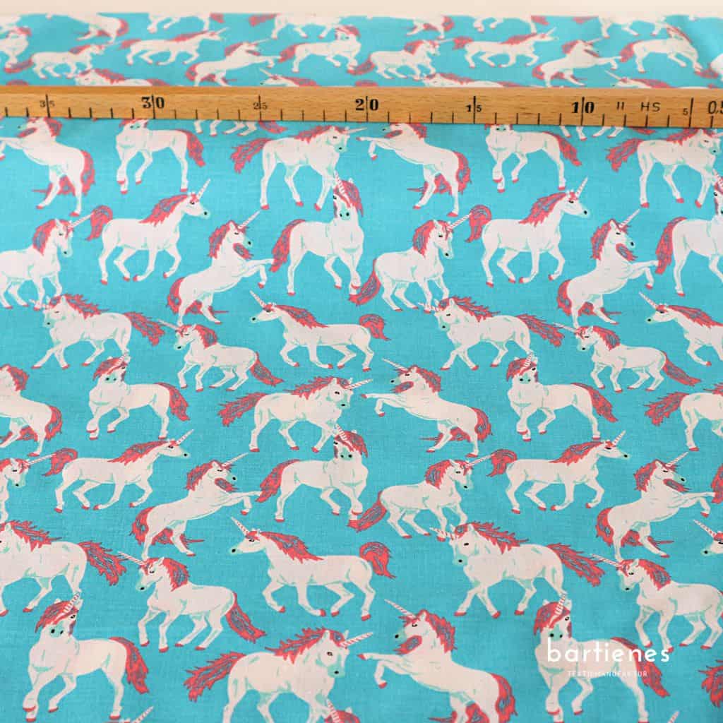 kinderstoff-weisse-einhörner-auf-leuchtend-türkis-meterware